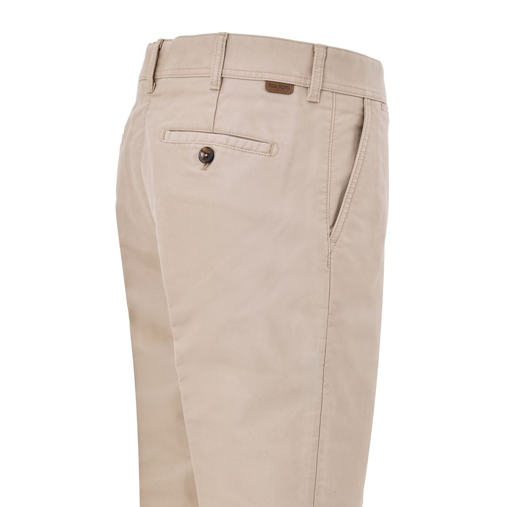 Chinos Pants by Tom Ford for men in cotton & leather beige features an utilitarian-chic silhouette, showcasing a utilitarian-chic straight with a long cut and for a refined look.