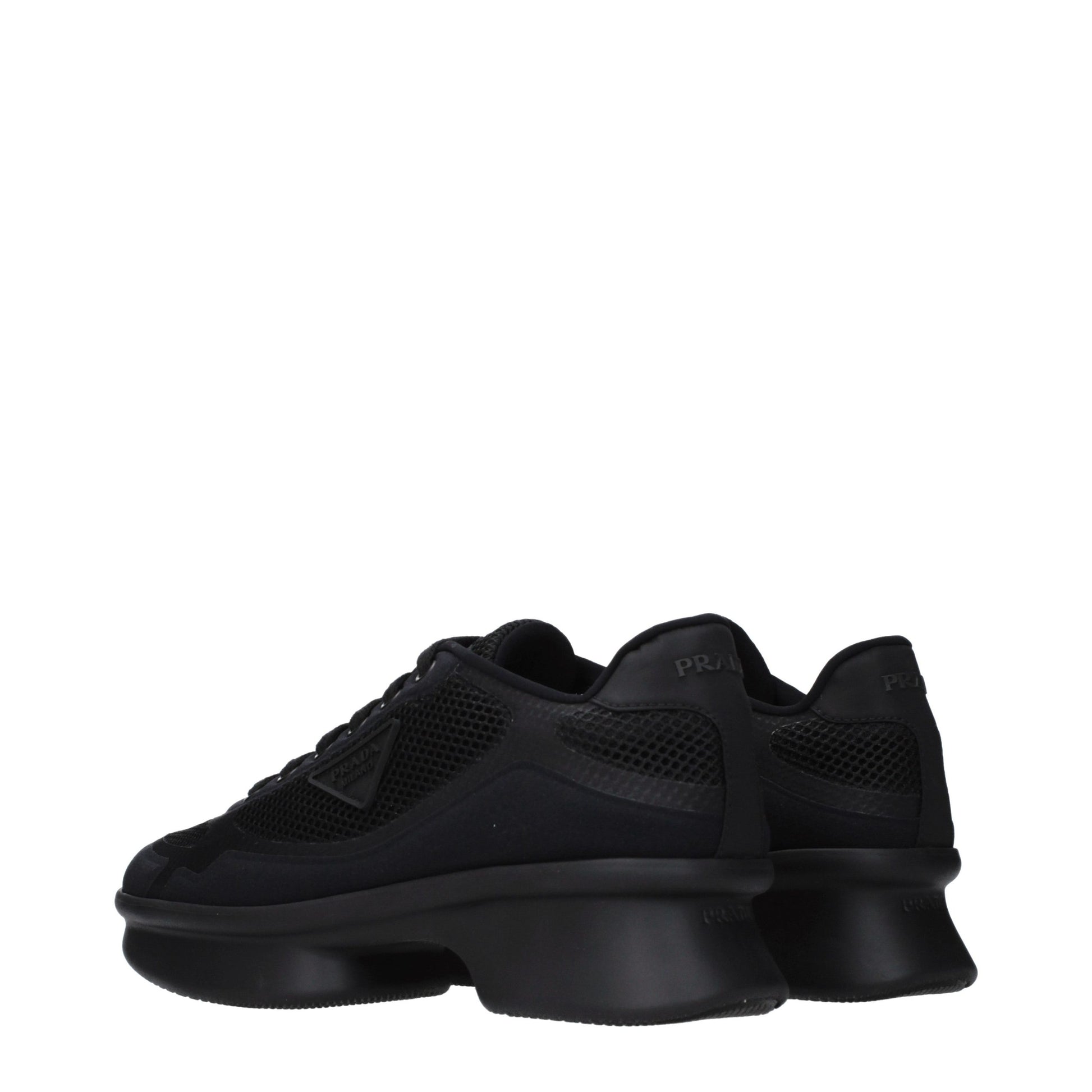 Sneakers by Prada for women in fabric black presents a sumptuous silhouette, artfully capturing the essence of the Women's Low Top Fabric Sneakers with its sumptuous low-top style design.