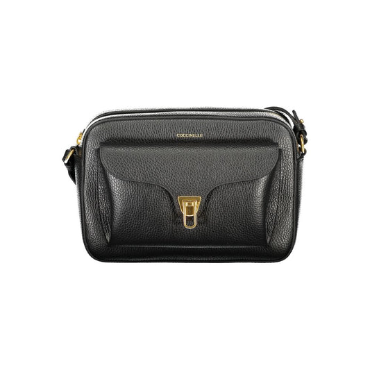 Handbag by Coccinelle for women in leather black, signature & print features a signature silhouette, showcasing a secure zipper and signature external-pockets & internal-pockets with versatile shoulder-strap & adjustable-strap for a sophisticated look.