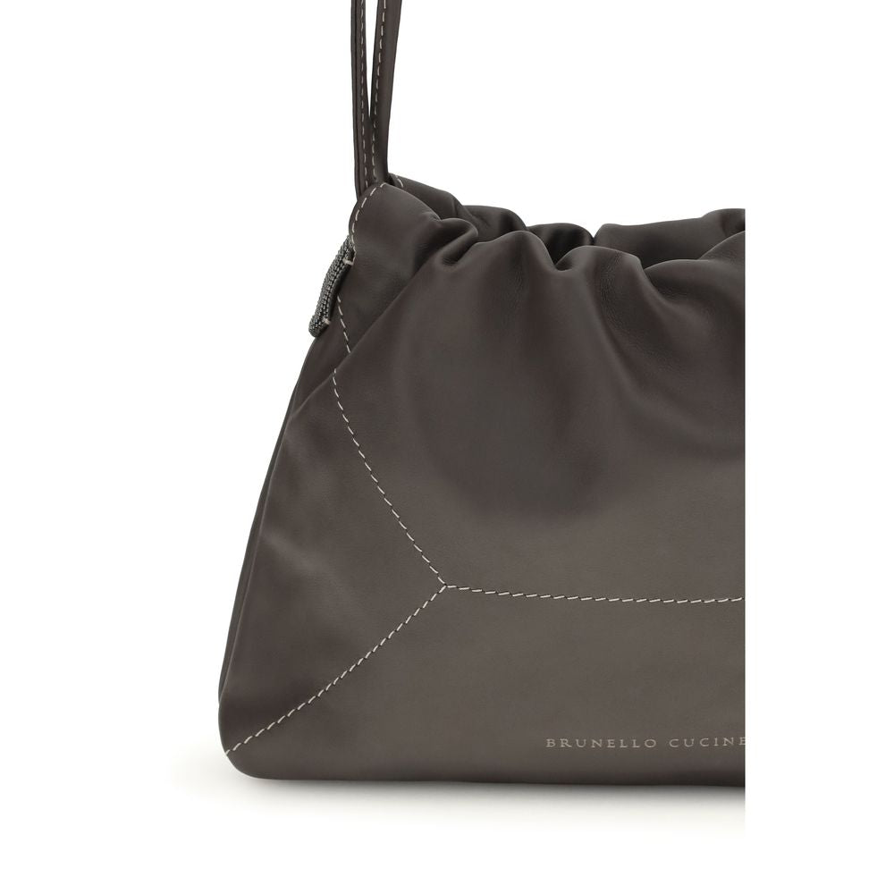 Shoulder Drawstring Bag by Brunello Cucinelli for women in bos taurus calf leather brown features a distinguished silhouette, showcasing a secure drawstring and distinguished with versatile shoulder-strap for a distinguished finish.
