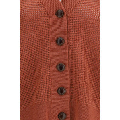 Cardigan by Brunello Cucinelli for women in cashmere & capra leather orange features a dramatic silhouette, showcasing a sophisticated and dramatic detail for a timeless, premium look.