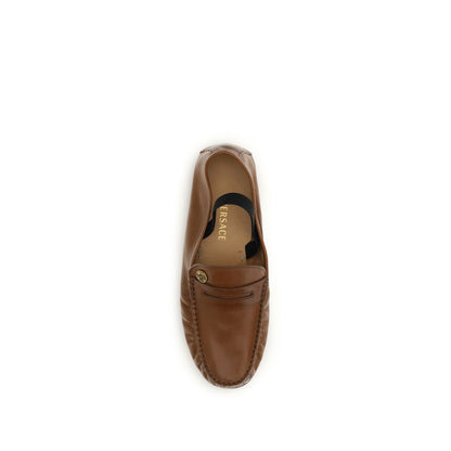 Flat Loafer Slip-On Shoes by Versace for women in leather brown & gold features an ergonomic silhouette, perfectly showcasing Medusa Women's Leather Flat Loafer Slip-On Shoes with its distinct flat and elegant .