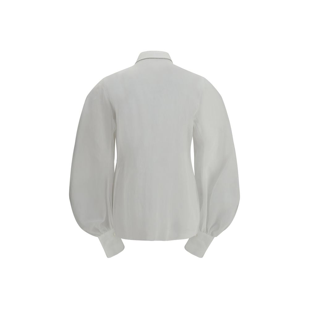 Blouse by Brunello Cucinelli for women in cotton white showcases a sleek silhouette, elegantly detailed with a sleek and for a sleek finish.