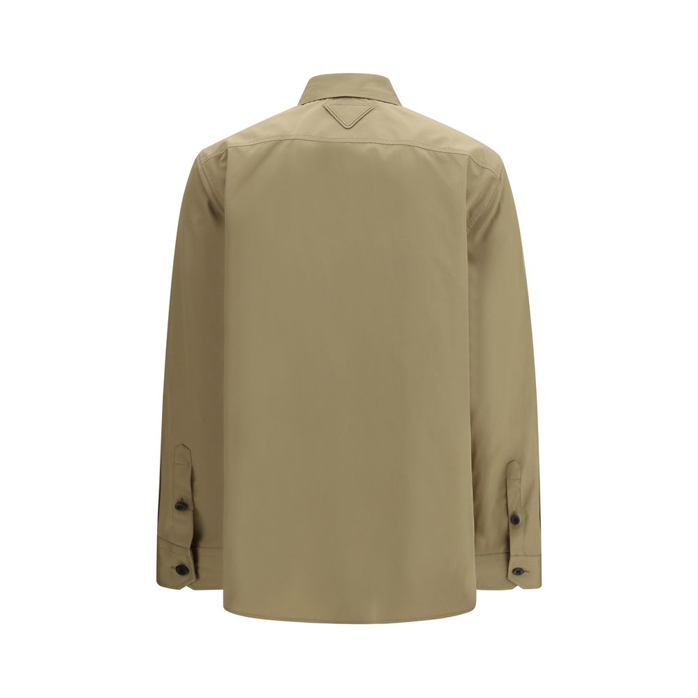 Shirt by Prada for women in cotton beige features an polished silhouette, showcasing a sophisticated and detail for a truly polished finish.