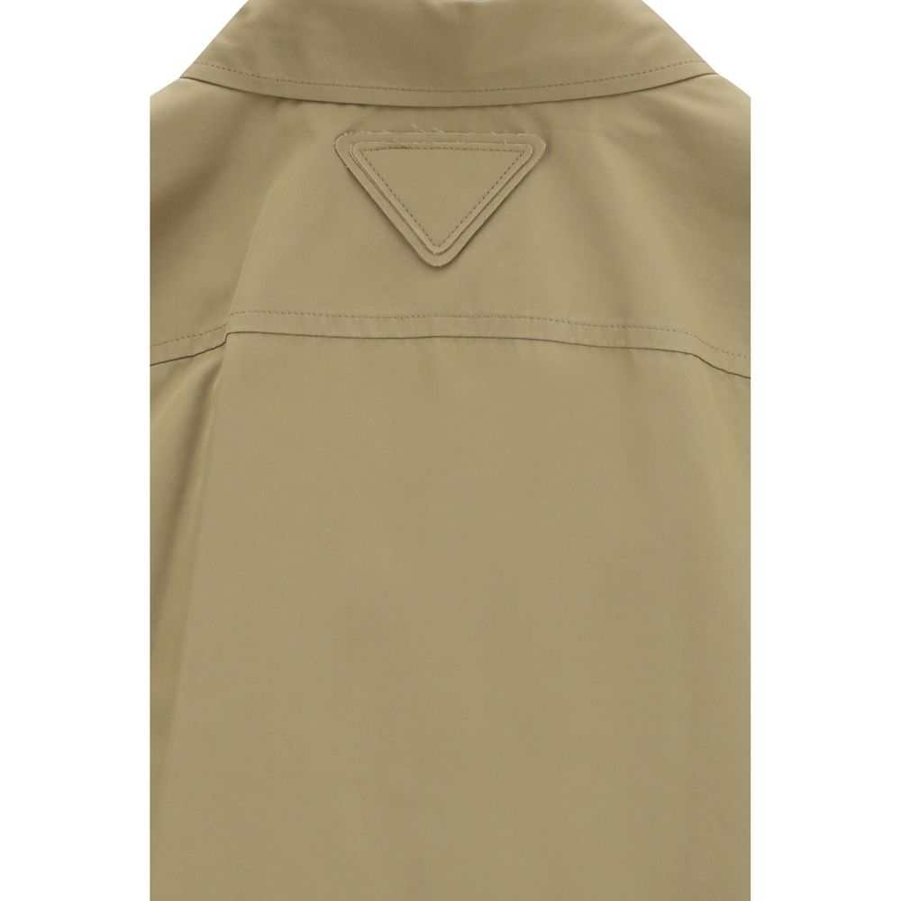 Shirt by Prada for women in cotton beige showcases a sharp silhouette, elegantly detailed with a sharp and sharp .