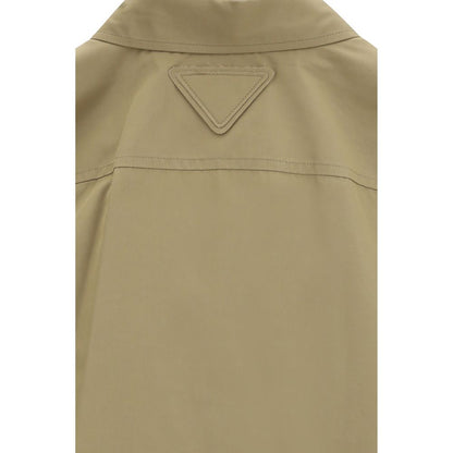 Shirt by Prada for women in cotton beige showcases a sharp silhouette, elegantly detailed with a sharp and sharp .