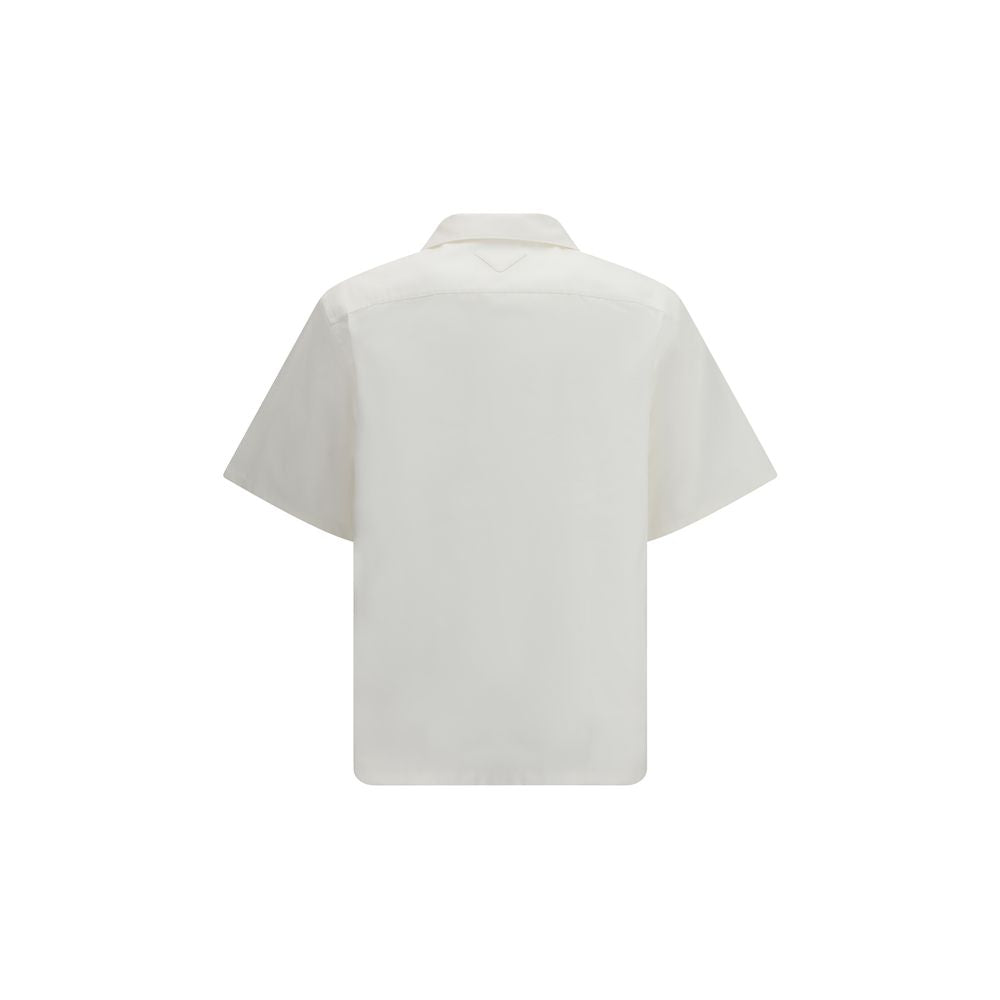 Shirt by Prada for men in cotton white & print presents a discerning silhouette, showcasing a sophisticated and for a truly discerning finish.