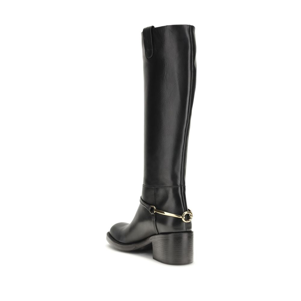 Lace-Up Riding Strap Boots by Chloé for women in bos taurus calfskin leather black & gold features an enchanting design from the Women's Bos Taurus Calfskin Leather Lace-Up Riding Strap Boots collection, highlighting a enchanting and for a refined look.