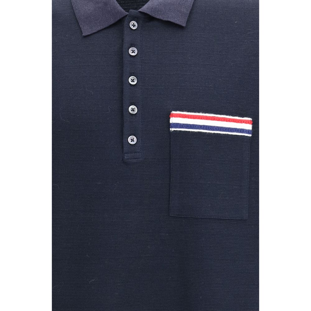 This Polo Shirt by Thom Browne for men in cotton linen & polyamide blue, signature & striped presents a flawless silhouette, showcasing flawless detailing and a refined for a truly flawless aesthetic.