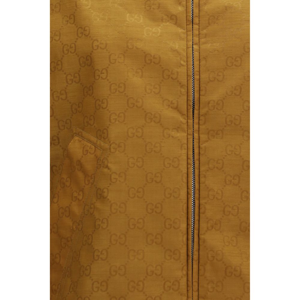 Hooded Windbreaker Jacket by Gucci for women in nylon beige & jacquard showcases a urban chic silhouette, detailed with a urban chic and functional lightweight, pockets, hooded & windproof for a polished finish.