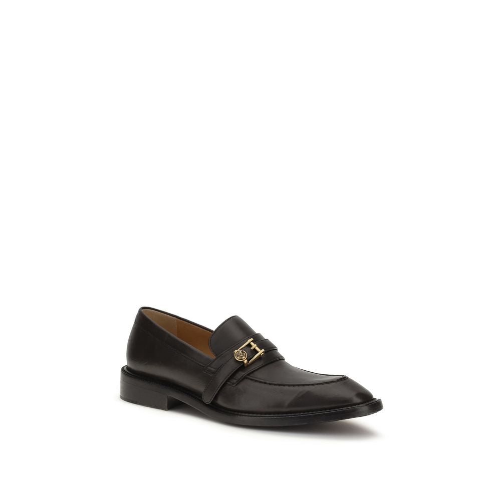 Loafer Slip-On Strap Shoes by Versace for men in bos taurus calf leather black showcases a timeless silhouette from the Medusa Men's Bos Taurus Calf Leather Loafer Slip-On Strap Shoes collection, featuring a timeless and for a timeless finish.
