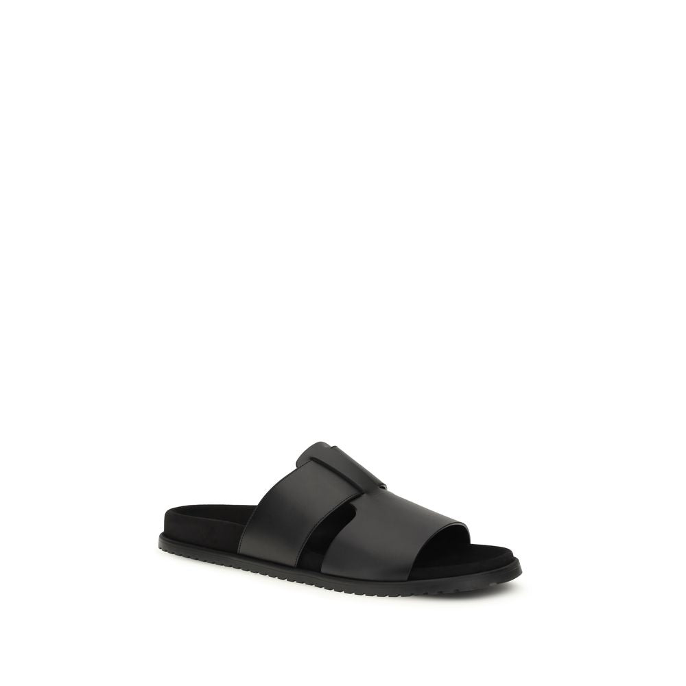 Flat Sandals by Dolce & Gabbana for men in bos taurus calf leather black features an effortlessly chic silhouette from the Men's Bos Taurus Calf Leather Flat Sandals collection, showcasing a effortlessly chic flat and elegant .