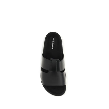 Flat Sandals by Dolce & Gabbana for men in bos taurus calf leather black presents a sculptural silhouette, showcasing the Men's Bos Taurus Calf Leather Flat Sandals design with a sculptural flat and for a premium look.