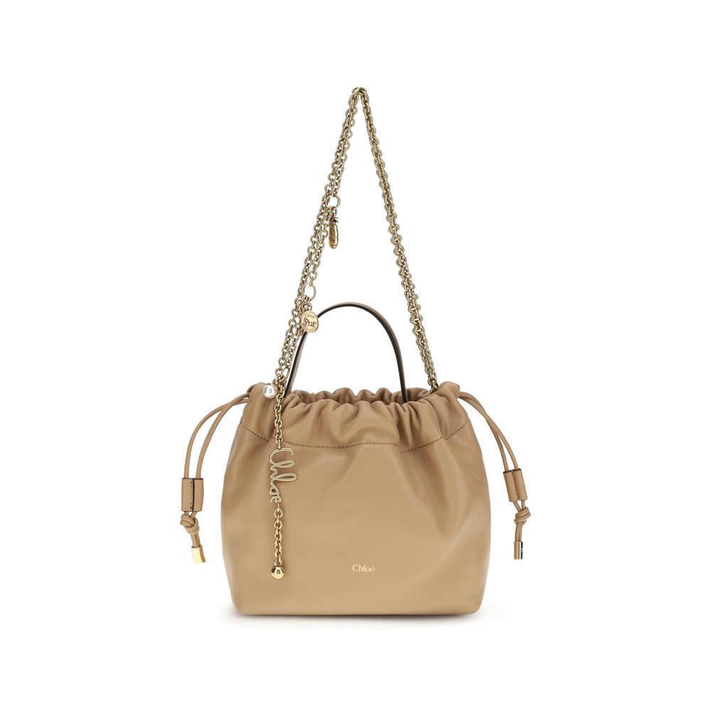Shoulder Drawstring Bag by Chloé for women in lambskin leather beige features a effortless sophistication silhouette, secured by a drawstring with ample and versatile shoulder-strap & handle for a effortless sophistication finish.