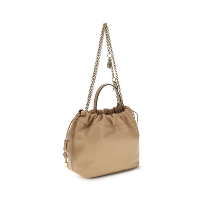 Shoulder Drawstring Bag by Chloé for women in lambskin leather beige showcases a enviable silhouette, artfully detailed with a secure drawstring, organized , and versatile shoulder-strap & handle for a enviable look.