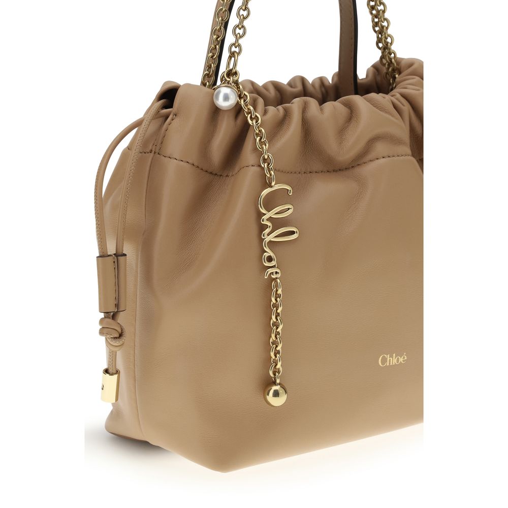 Shoulder Drawstring Bag by Chloé for women in lambskin leather beige features a enviable silhouette, showcasing a secure drawstring, ample , and enviable shoulder-strap & handle for a enviable finish.