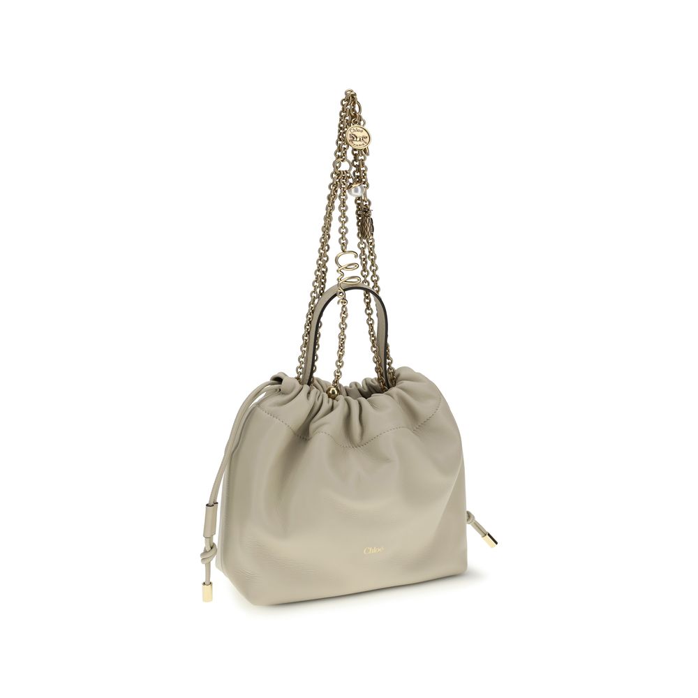 Shoulder Drawstring Bag by Chloé for women in nappa lambskin leather beige features a enviable silhouette, showcasing a secure drawstring, ample , and enviable shoulder-strap & handle for a enviable finish.