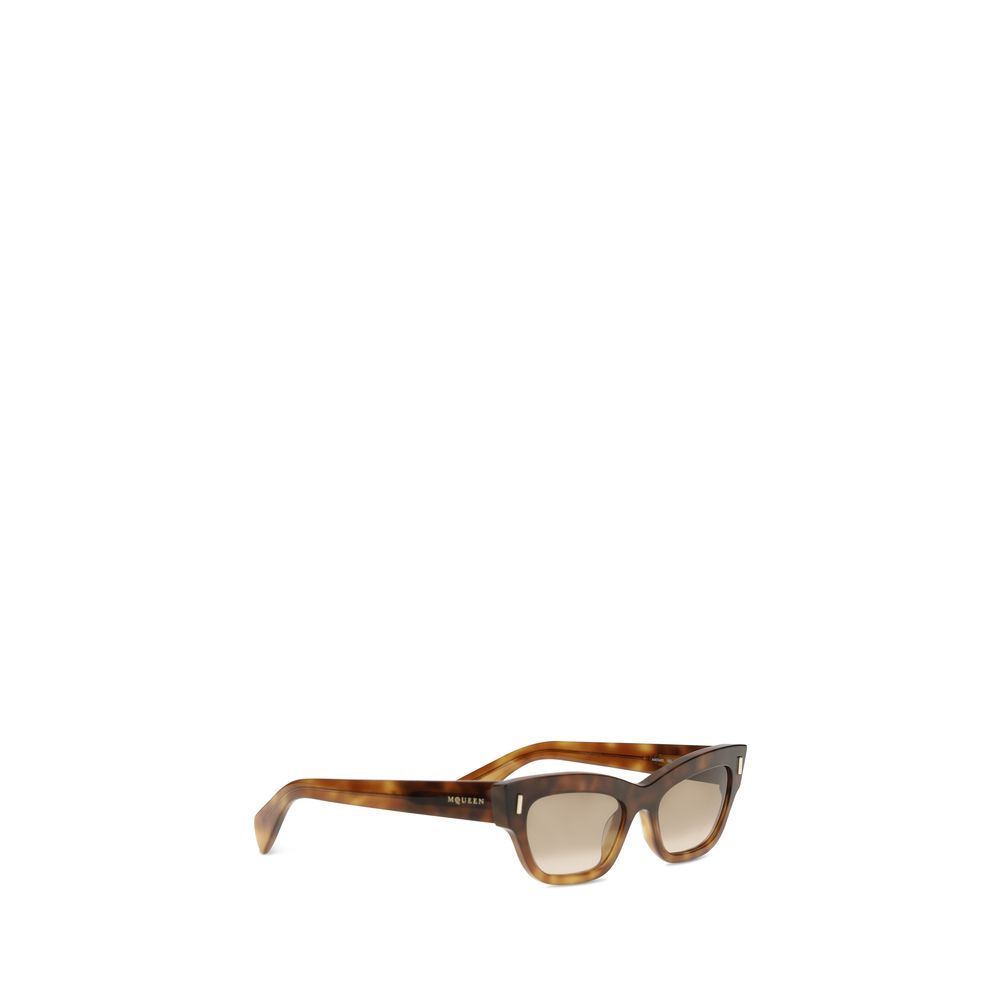 Sunglasses by Alexander McQueen for women in wool polyamide tweed brown & gold features a contemporary silhouette, showcasing a contemporary cat-eye frame design in brown coloured frame with high-performance .