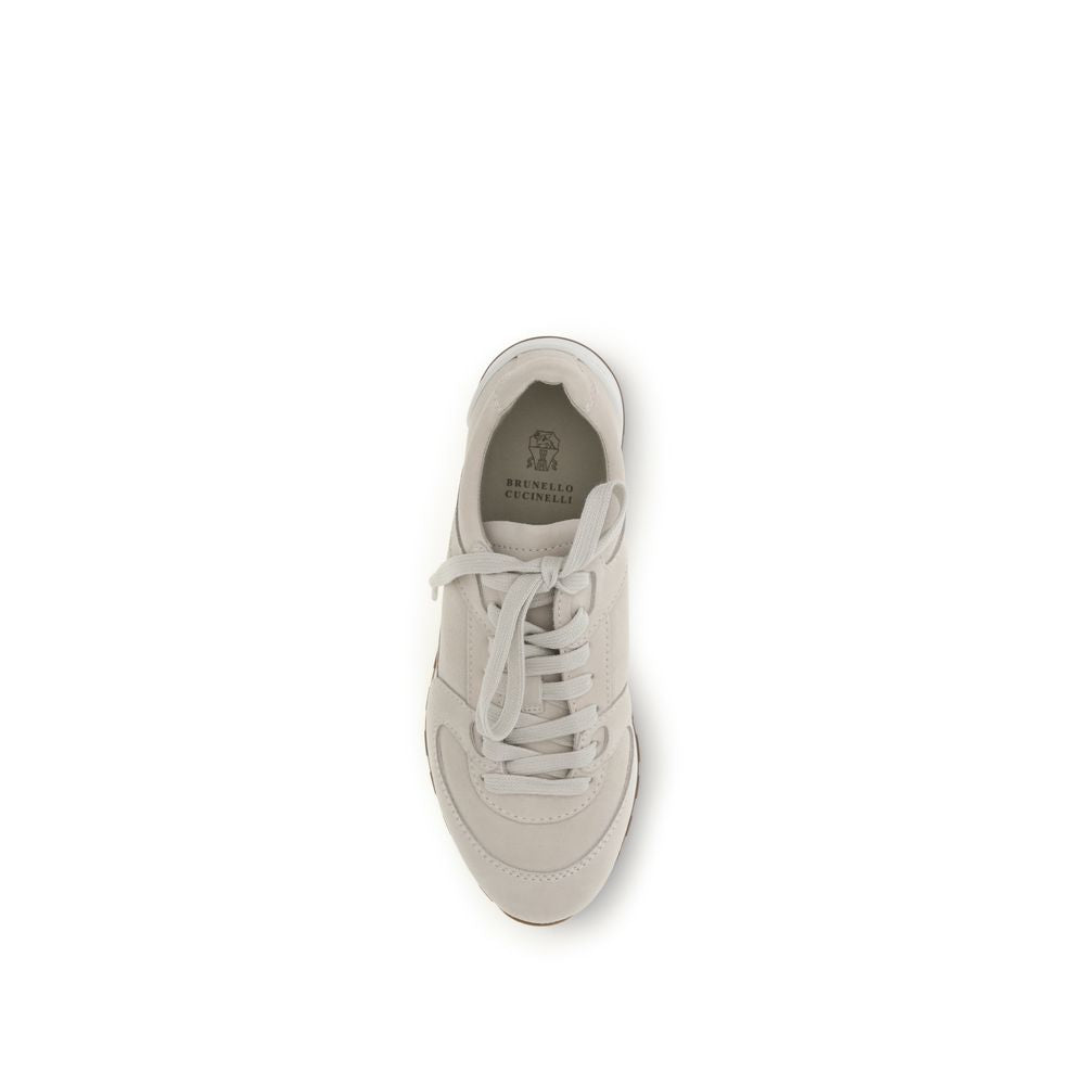 Sneakers by Brunello Cucinelli for women in bos taurus calf suede leather beige features a chic design, perfectly showcasing the chic low-top style of this Women's Low Top Bos Taurus Calf Suede Leather Sneakers.