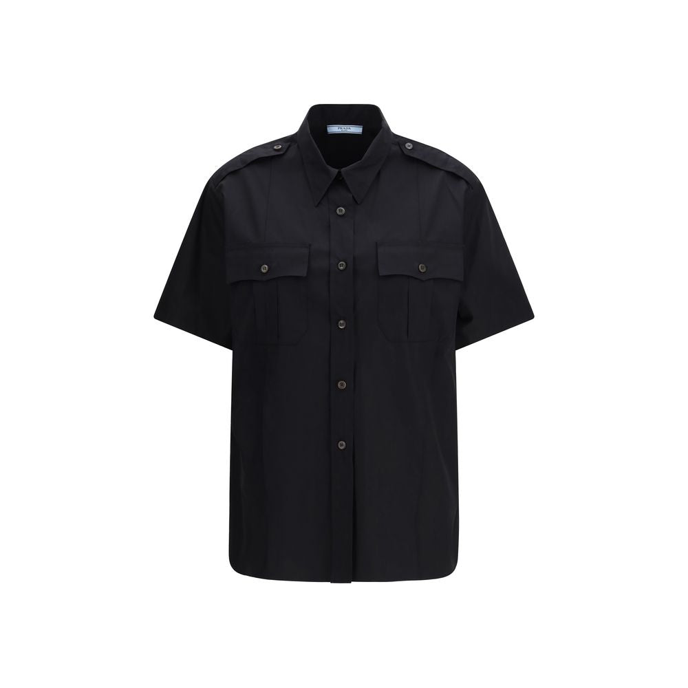Shirt by Prada for women in cotton black showcases a sharp silhouette, elegantly detailed with a sharp and sharp short-sleeve.