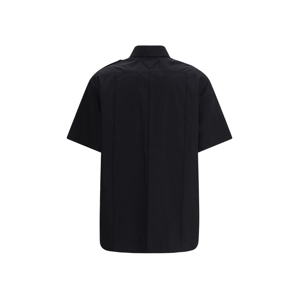 Shirt by Prada for women in cotton black showcases a sleek silhouette, elegantly detailed with a sleek and for a sleek finish.