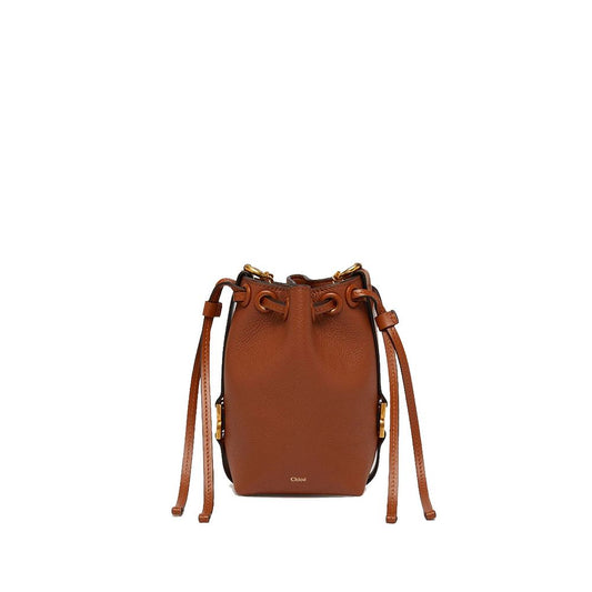 Bucket Handbag by Chloé for women in calfskin leather brown & gold features a effortlessly chic silhouette, showcasing a secure drawstring and ample with versatile adjustable-strap & detachable-strap for a effortlessly chic finish.