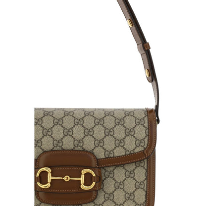 This Shoulder Flap Handbag by Gucci for women in polyester polyurethane leather & cotton and beige, gold, jacquard & print presents a sculptural silhouette featuring a secure flap, ample , and versatile shoulder-strap & adjustable-strap for a sculptural finish.