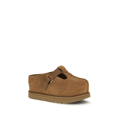 Mules Flat Shoes by UGG for women in eva & bos taurus suede calf leather brown showcases a enchanting silhouette as part of the Women's EVA & Bos Taurus Suede Calf Leather Mules Flat Shoes collection, defined by a enchanting and for a enchanting look.