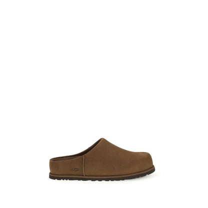 Flat Mule Mules Slip-On Shoes by UGG for men in eva & bos taurus nubuck calf leather brown showcases a resplendent Men's EVA & Bos Taurus Nubuck Calf Leather Flat Mule Mules Slip-On Shoes aesthetic, defined by its resplendent and elegant flat.