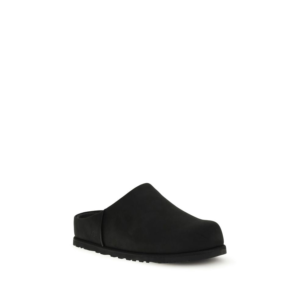 Flat Mule Mules Slip-On Shoes by UGG for men in eva & bos taurus nubuck calf leather black showcases a impeccable silhouette as Men's EVA & Bos Taurus Nubuck Calf Leather Flat Mule Mules Slip-On Shoes, artfully designed with a impeccable flat and refined for a impeccable finish.
