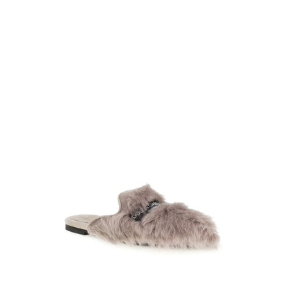 Mules Flat Shoes by Dolce & Gabbana for women in goatskin leather gray showcases a enchanting silhouette as part of the Women's Goatskin Leather Mules Flat Shoes collection, defined by a enchanting and for a enchanting look.