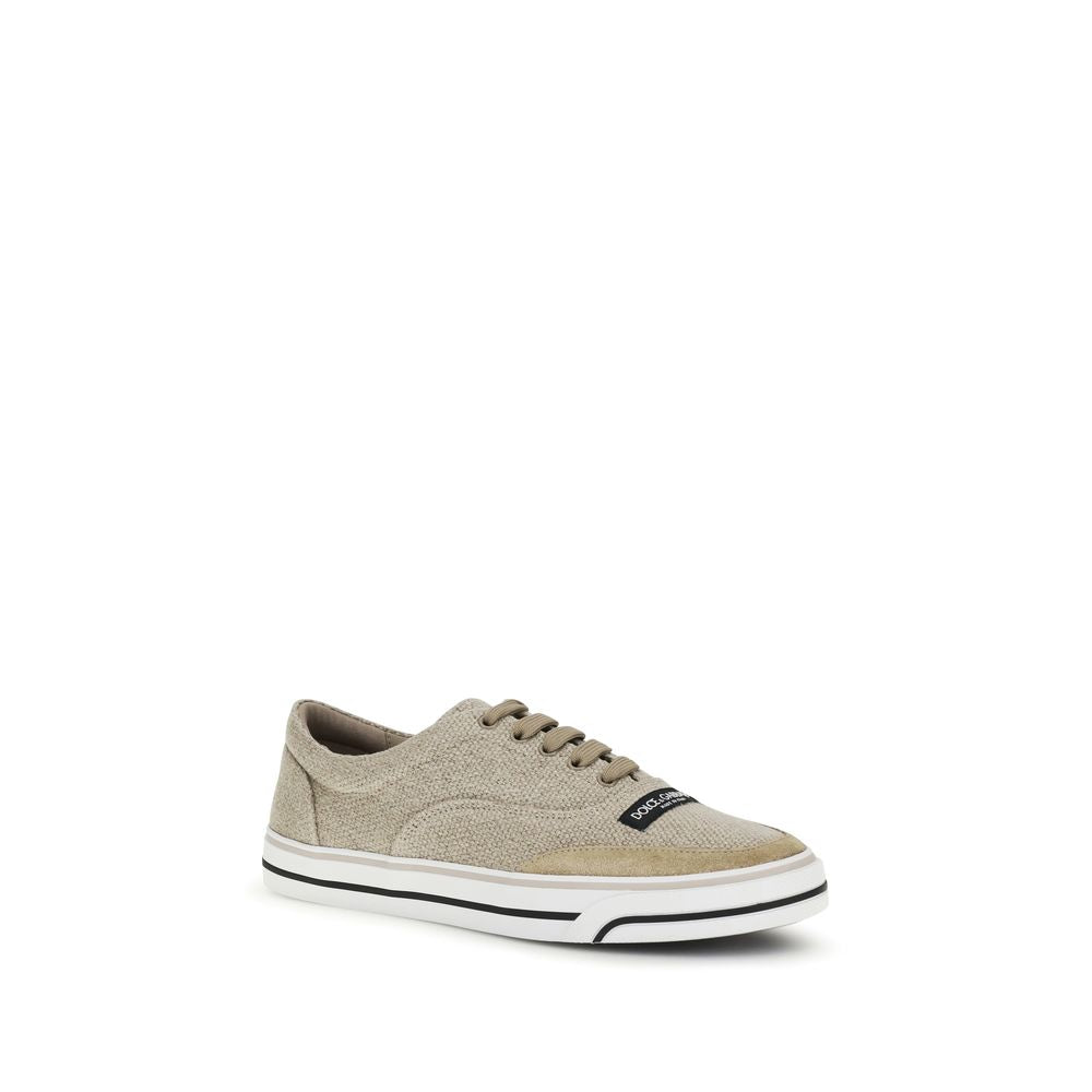 Sneakers by Dolce & Gabbana for men in bos taurus calf leather latex & linen beige presents a sumptuous silhouette, artfully capturing the essence of the Men's Low Top Bos Taurus Calf Leather Latex & Linen Sneakers with its sumptuous low-top style design.