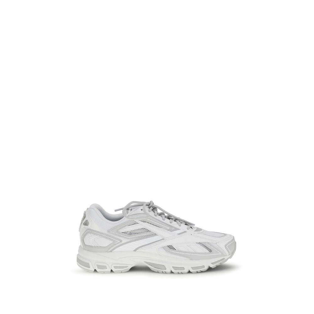 Athletic Sneakers by Reebok for men in polyester polyethylene & polyurethane white showcases a architectural silhouette, artfully capturing the essence of the Men's Athletic Polyester Polyethylene & Polyurethane Sneakers with its signature architectural athletic style construction.