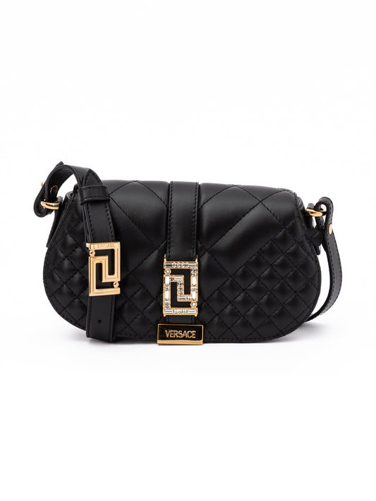 Medium Quilted Shoulder Bag by Versace for women in lamb leather black features a stately silhouette, showcasing a secure , ample internal-pockets, and stately shoulder-strap, adjustable-strap & handle for a stately finish.
