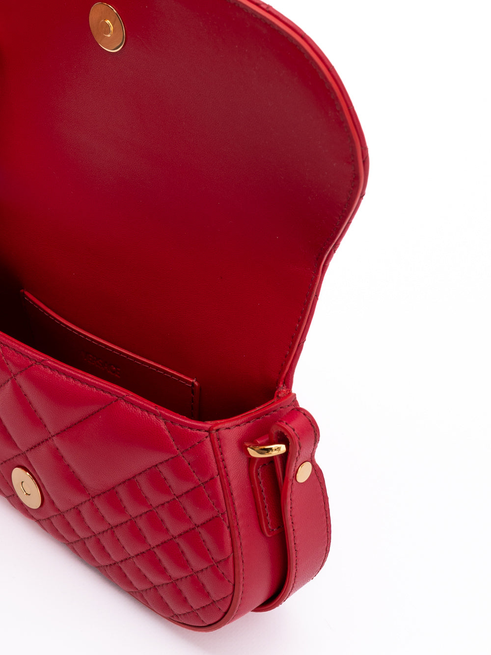 Medium Quilted Shoulder Bag by Versace for women in lamb leather red showcases a statuesque silhouette, artfully detailed with a secure , organized internal-pockets, and versatile shoulder-strap, adjustable-strap & handle for a statuesque look.