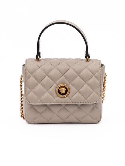 Medium Quilted Shoulder Bag by Versace for women in lamb leather beige presents a statuesque silhouette, showcasing a secure and statuesque internal-pockets with versatile shoulder-strap & handle for a sophisticated look.