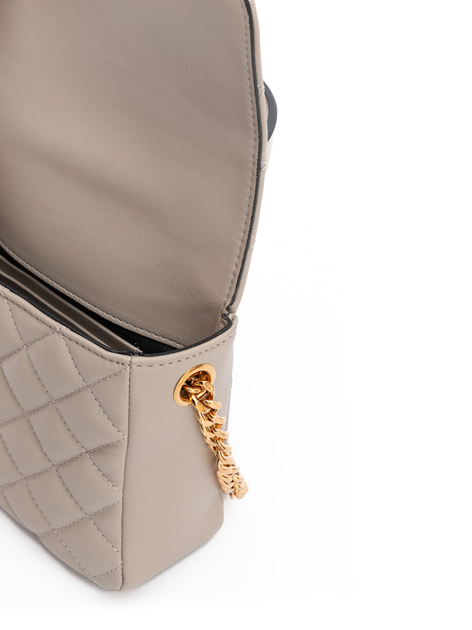 Medium Quilted Shoulder Bag by Versace for women in lamb leather beige features a stately silhouette, showcasing a secure , ample internal-pockets, and stately shoulder-strap & handle for a stately finish.