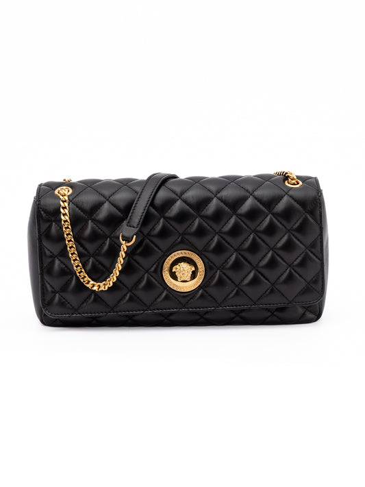 Medium Quilted Shoulder Bag by Versace for women in lamb leather black features an effortlessly chic silhouette with a secure , ample internal-pockets, and versatile shoulder-strap & handle for effortlessly chic everyday luxury.