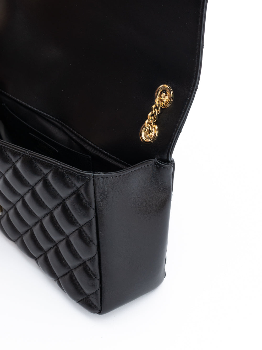 Medium Quilted Shoulder Bag by Versace for women in lamb leather black features a effortless chic silhouette with a secure , ample internal-pockets, and versatile shoulder-strap & handle for a effortless chic finish.