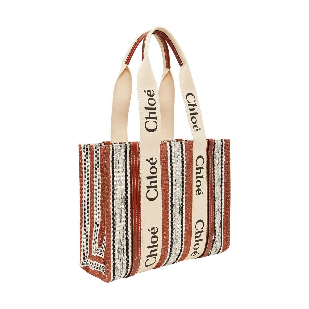 This Large Tote Bag by Chloé for women in cotton polyester canvas brown & signature features an jet-set Cotton Polyester Canvas Large Tote Bag design with a secure , ample , and jet-set handle.