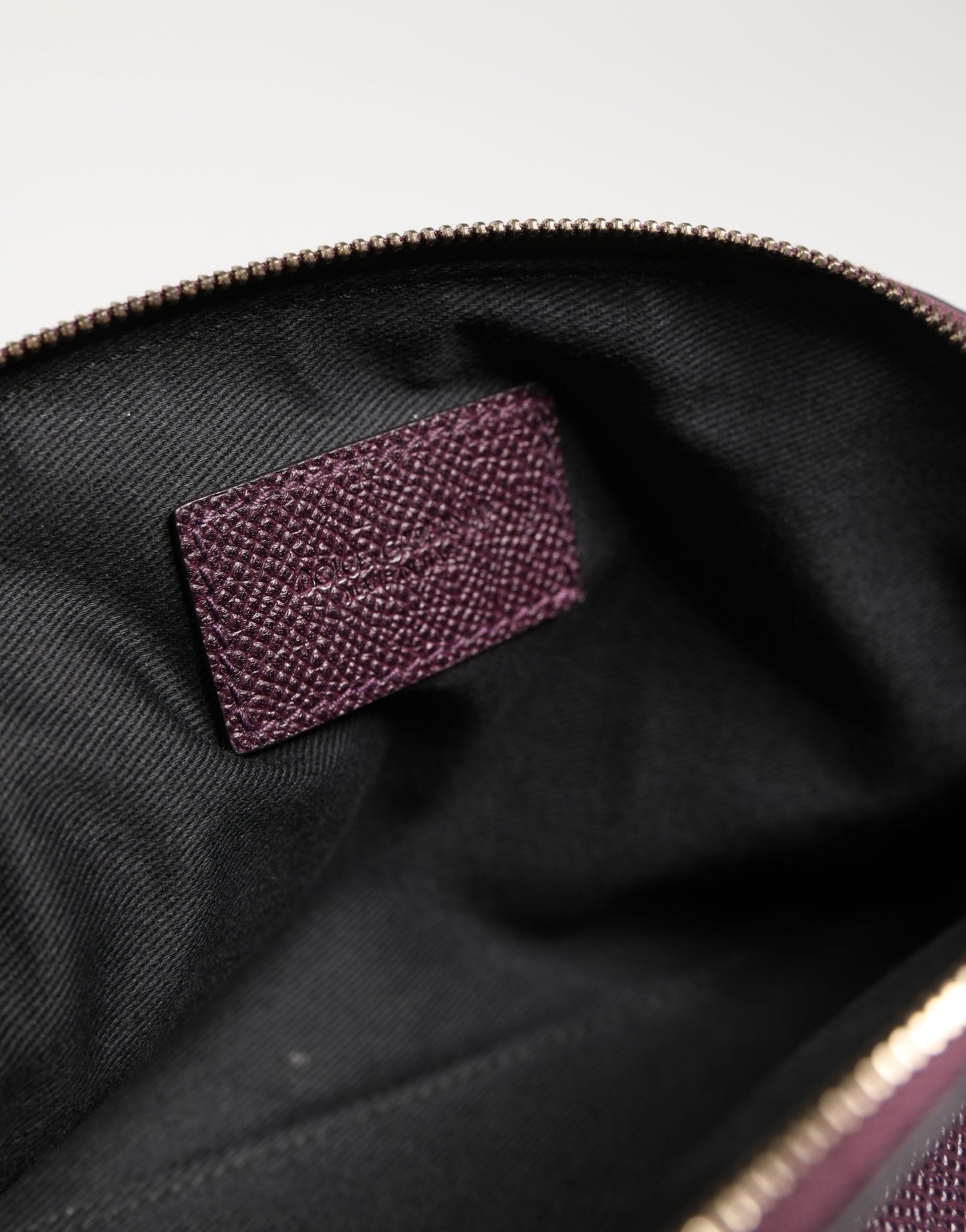 Card Case by Dolce & Gabbana for women in calfskin leather purple features a sleek silhouette, showcasing the sleek design of the Calfskin Leather Card Case with functional zip-around for a premium look.