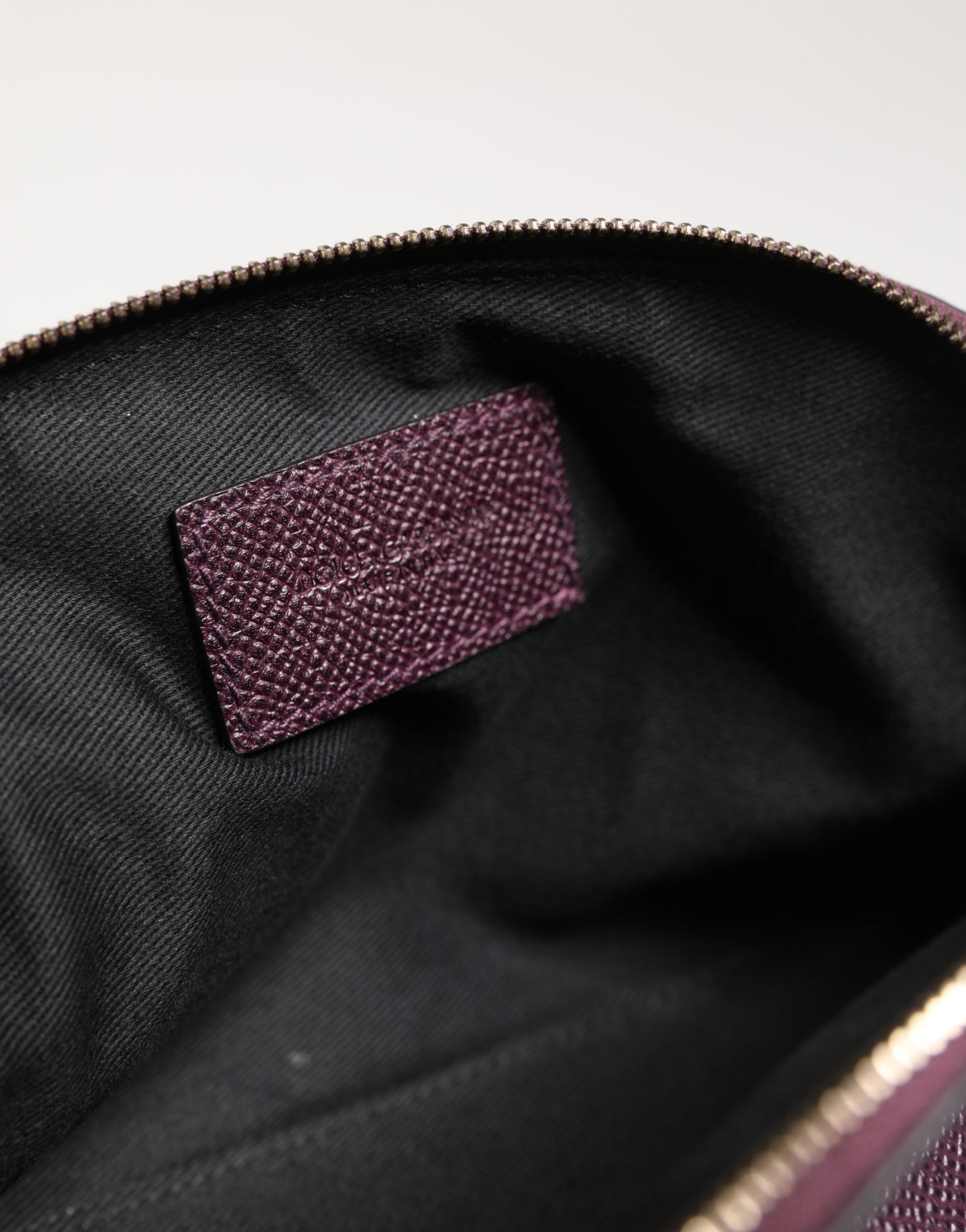 Card Case by Dolce & Gabbana for women in calfskin leather purple features a sleek silhouette, showcasing the sleek design of the Calfskin Leather Card Case with functional zip-around for a premium look.
