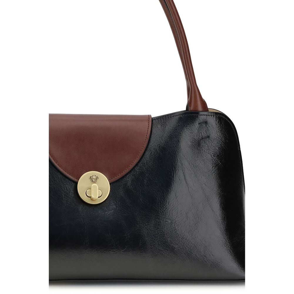Medium Shoulder Flap Bag by Versace for women in bos taurus calf leather black features a effortless sophistication silhouette, secured by a snap & flap with ample built-in-compartments and versatile shoulder-strap & handle for a effortless sophistication finish.