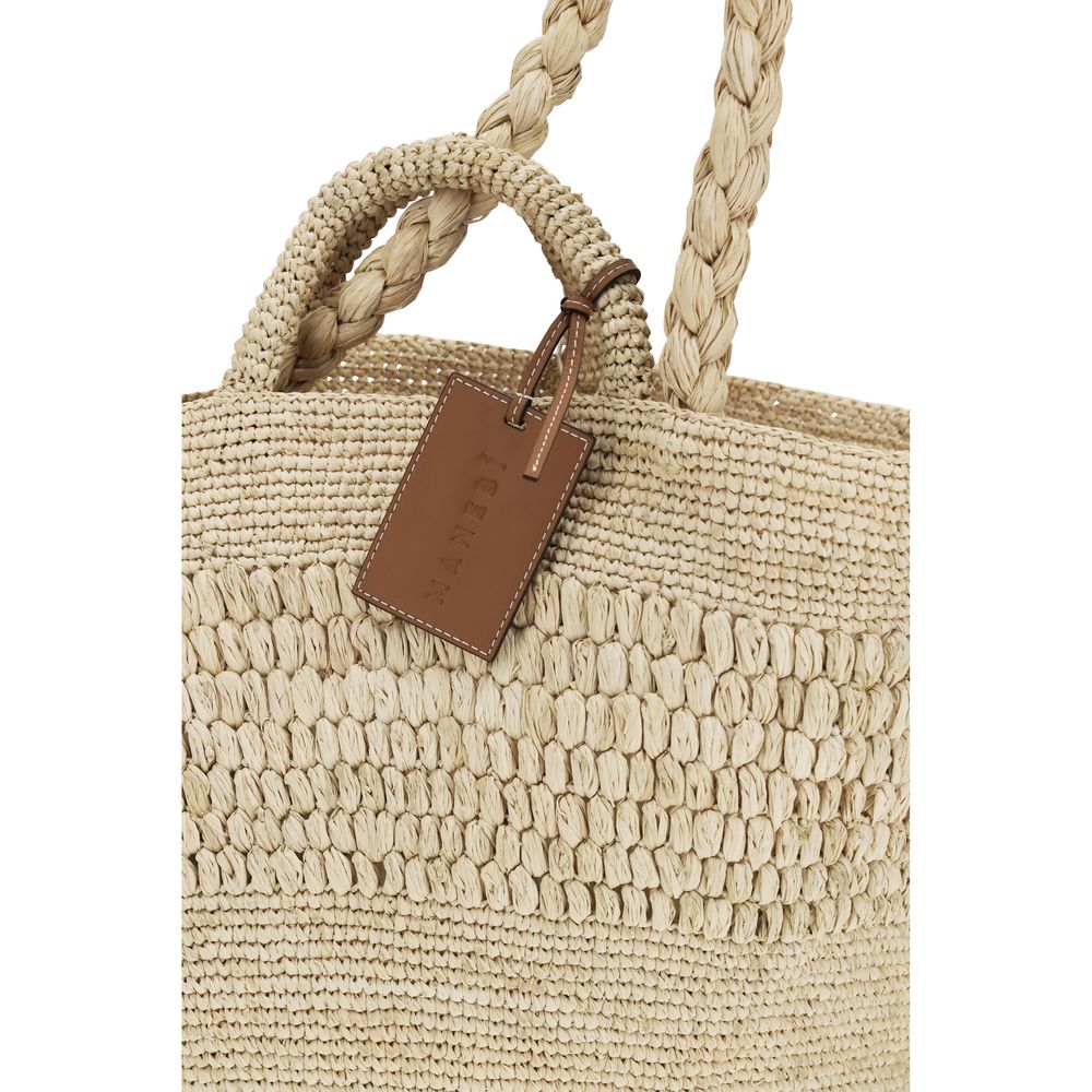 This Shoulder Baguette Handbag by Manebi for women in leather & raffia and beige presents a sculptural silhouette featuring a secure , ample , and versatile handle for a sculptural finish.