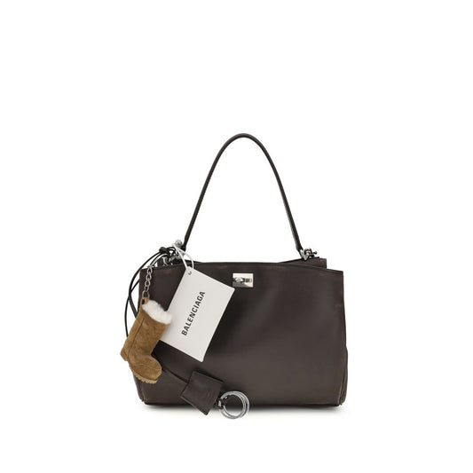 Small Shoulder Bag by Balenciaga for women in polyester polyurethane lambskin & calf leather brown features an effortlessly chic silhouette with a secure , ample , and versatile shoulder-strap & handle for effortlessly chic everyday luxury.