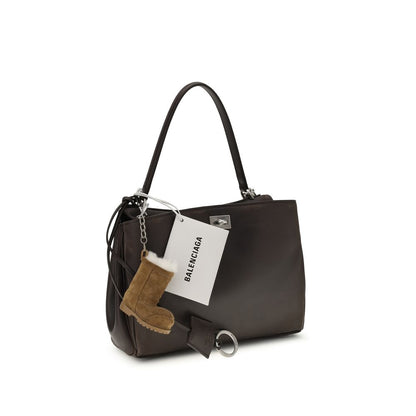 Small Shoulder Bag by Balenciaga for women in polyester polyurethane lambskin & calf leather brown showcases a enviable silhouette, artfully detailed with a secure , organized , and versatile shoulder-strap & handle for a enviable look.