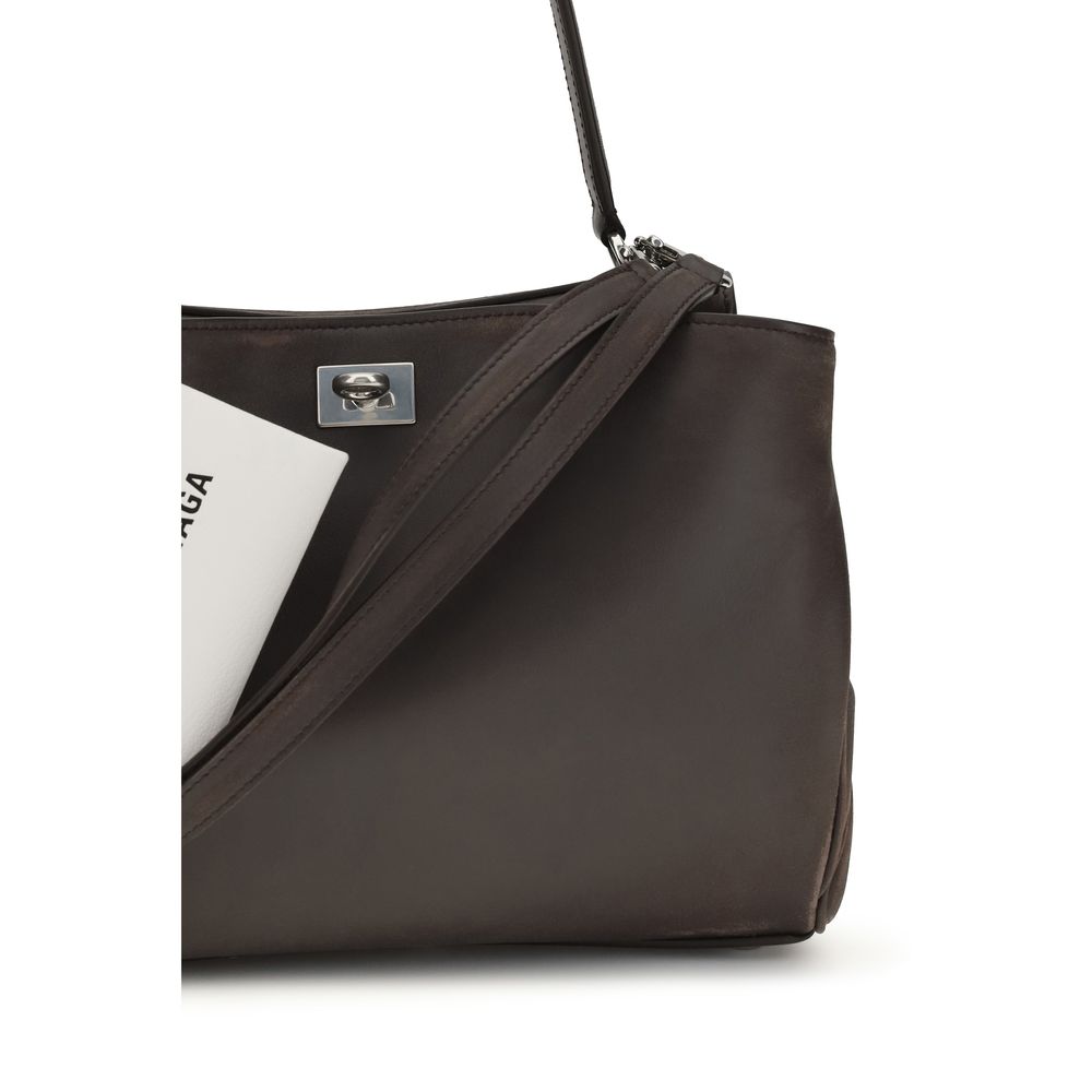 Small Shoulder Bag by Balenciaga for women in polyester polyurethane lambskin & calf leather brown features a enviable silhouette, showcasing a secure , ample , and enviable shoulder-strap & handle for a enviable finish.