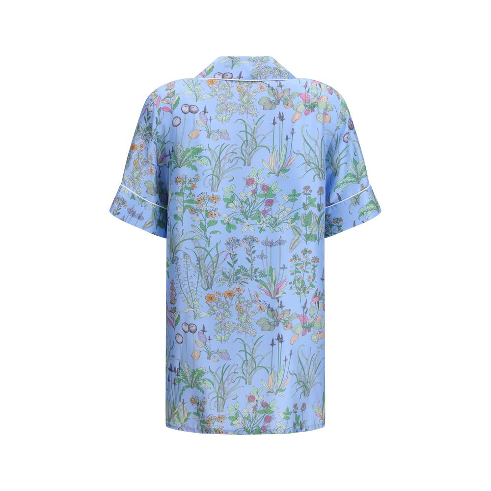 Shirt by Gucci for women in silk twill light-blue, patterned, floral & print presents a discerning silhouette, showcasing a sophisticated and for a truly discerning finish.