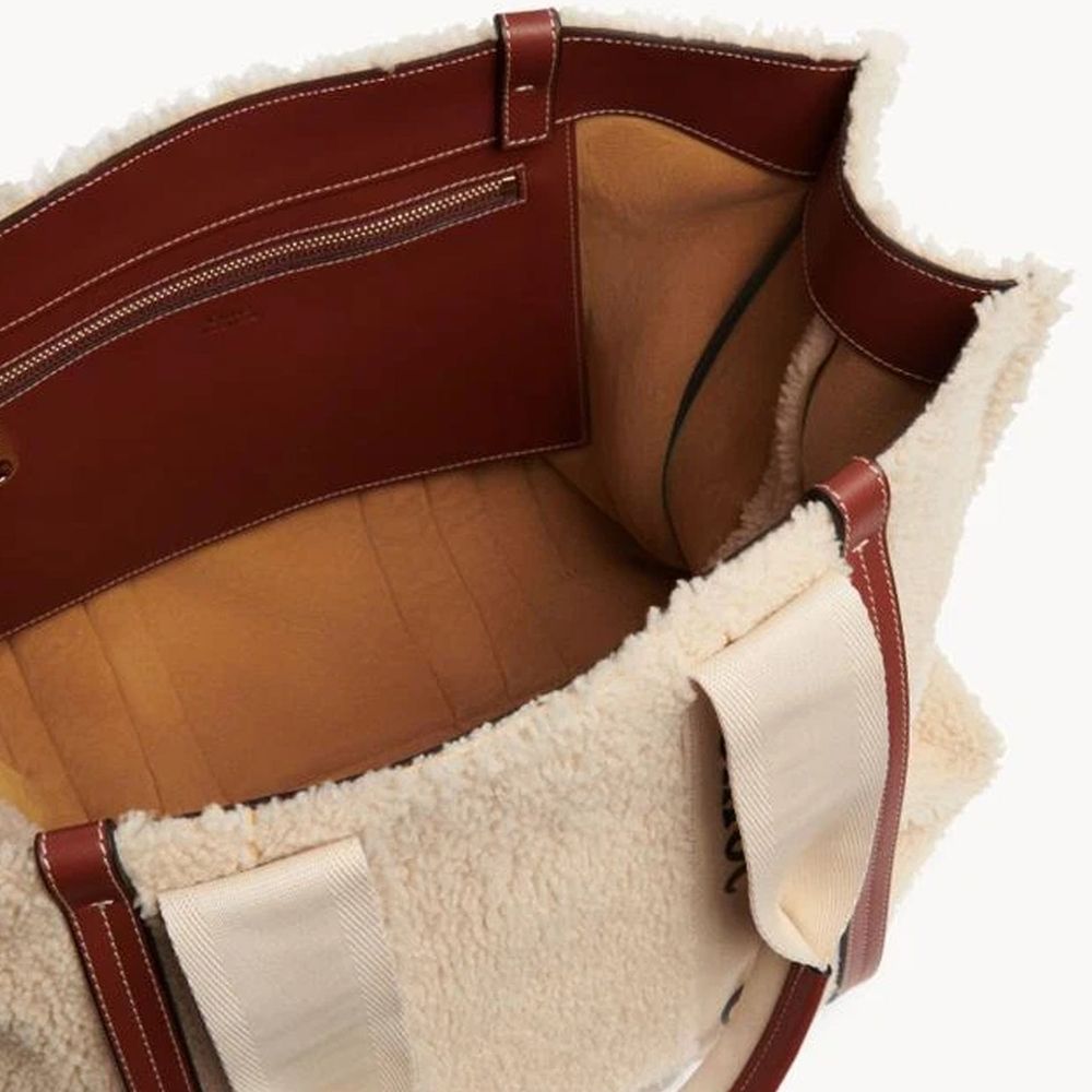 Tote Bag by Chloé for women in fur beige & signature features a jet-set sophisticated Fur Tote Bag design with a secure , ample , and versatile handle for a jet-set sophisticated finish.