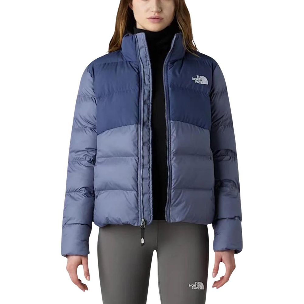 Overcoat by The North Face for women in polyester blue features a contemporary silhouette showcasing a contemporary high-collar neckline and refined pockets & insulated for a sophisticated finish.